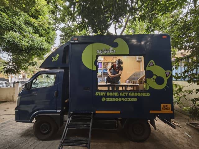 Masterpet mobile grooming van parked outside - professional at-home pet grooming service in Kochi